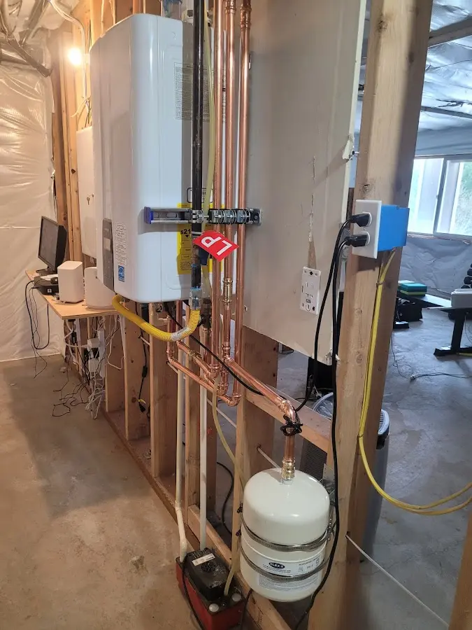 Licensed plumber repairing a kitchen sink in Pelham
